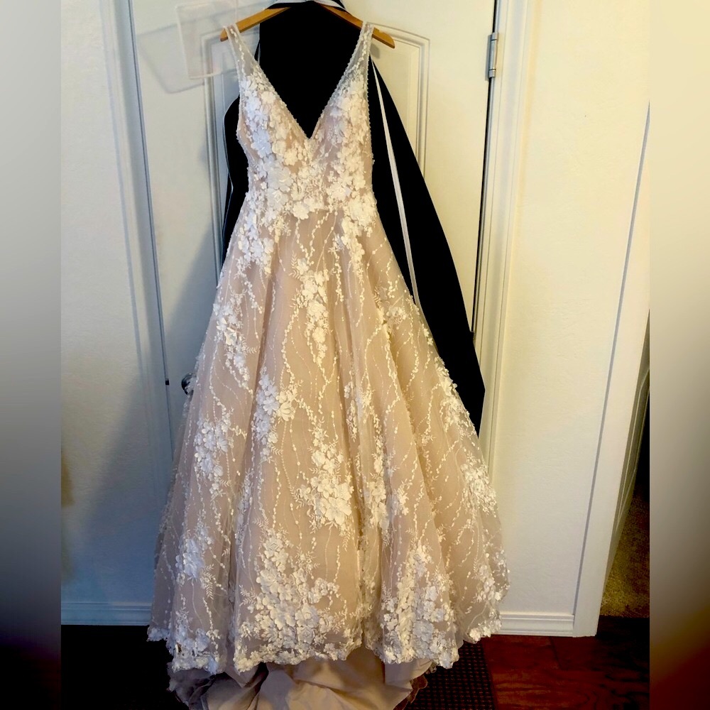 Beautiful Wedding dress-never worn down the aisle $1400.00